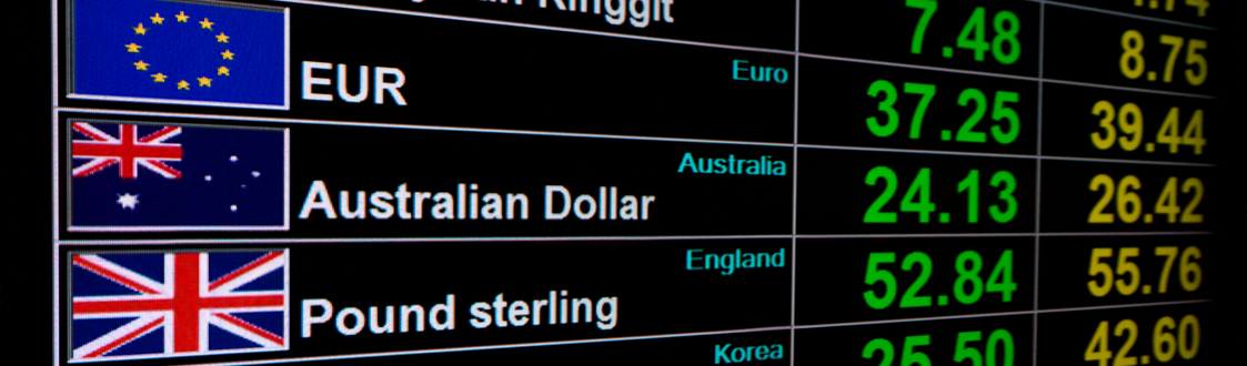 Exchange rate board showing EUR, AUD and GBP and various rates.